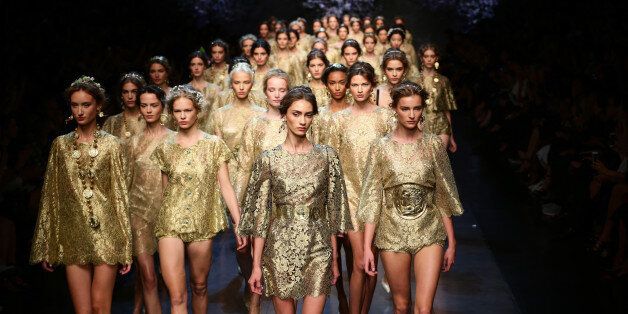 MILAN, ITALY - SEPTEMBER 22: Models walk the runway during the Dolce & Gabbana show as part of Milan Fashion Week Womenswear Spring/Summer 2014 on September 22, 2013 in Milan, Italy. (Photo by Vittorio Zunino Celotto/Getty Images)