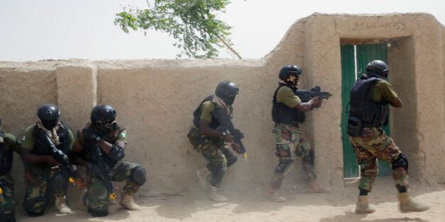 Nigerian special forces participate in an hostage rescue exercise at the end of the Flintlock exercise in Mao, Chad, Saturday, March 7, 2015. The U.S. military and its Western partners conduct this training annually and set up plans long before Boko Haram began attacking its neighbors Niger, Chad and Cameroon. (AP Photo/Jerome Delay)