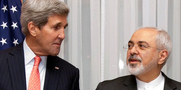 U.S. Secretary of State John Kerry, left, listens to Iran's Foreign Minister Mohammad Javad Zarif, right, before resuming talks over Iran's nuclear program in Lausanne, Switzerland, Monday, March 16, 2015. The United States and Iran are plunging back into negotiations in a bid to end a decades-long standoff that has raised the specter of an Iranian nuclear arsenal, a new atomic arms race in the Middle East and even a U.S. or Israeli military intervention. (AP Photo/Brian Snyder, Pool)