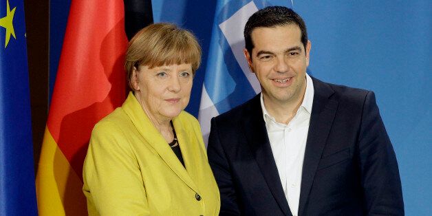 German Chancellor Angela Merkel, and the Prime Minister of Greece, Alexis Tsipras, right, shake hands after a press conference as part of a meeting at the chancellery in Berlin, Germany, Monday, March 23, 2015. (AP Photo/Michael Sohn)