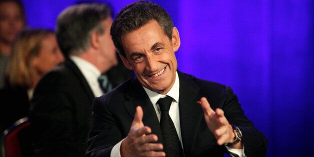 Former French President and conservative party UMP leader Nicolas Sarkozy attends a meeting in Asnieres, France, Tuesday March 24, 2015. The top two parties in weekend local elections were the conservative UMP and the far right National Front. (AP Photo/Thibault Camus)