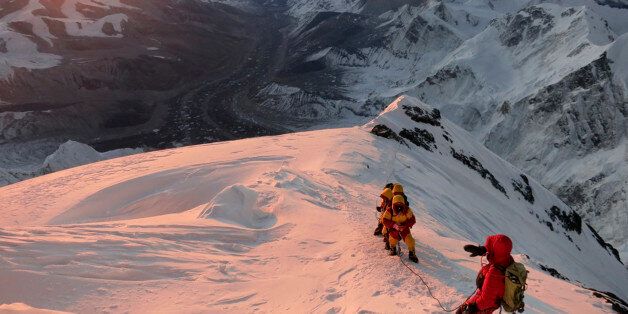 FILE - In this May 18, 2013 file photo released by mountain guide Adrian Ballinger of Alpenglow Expeditions, climbers make their way to the summit of Mount Everest, in the Khumbu region of the Nepal Himalayas. An avalanche swept down a climbing route on Mount Everest early Friday, April 18, killing at least 12 Nepalese guides and leaving three missing in the deadliest disaster on the world's highest peak. (AP Photo/Alpenglow Expeditions, Adrian Ballinger, File) MANDATORY CREDIT, EDITORIAL USE ONLY