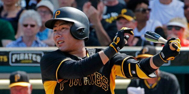 Pittsburgh Pirates' Jung Ho Kang of Korea hits a double during a spring training exhibition baseball game against the New York Yankees in Bradenton, Fla., Thursday, March 5, 2015.  (AP Photo/Gene J. Puskar)