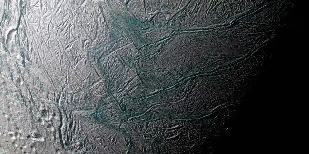 This image provided by NASA  of Saturn's moon Enceladus was made by the Casini spacecraft during a fly-by on Aug. 11, 2008.  This false-color mosaic combines Imaging Science Subsystem (ISS) narrow-angle camera images obtained through ultraviolet, green, and near-infrared camera filters. Areas that are greenish in appearance are believed to represent deposits of coarser grained ice and solid boulders that are too small to be seen at this scale. The whitish deposits represent finer grained ice. Th