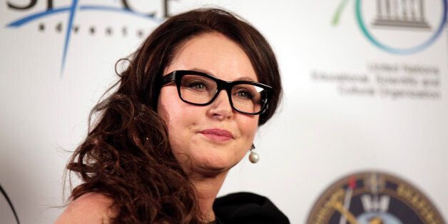 British singer Sarah Brightman poses for the photographers following a news conference, in central London, Tuesday, March 10, 2015. Brightman is scheduled to travel as a space tourist to the International Space Station on a trip scheduled for launch on Sept. 1, 2015. (AP Photo/Lefteris Pitarakis)