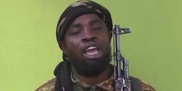FILE -This May 12, 2014, file photo taken from video by Nigeria's Boko Haram terrorist network, shows their leader Abubakar Shekau speaking to the camera. Islamic State militants have accepted a pledge of allegiance by the Nigerian-grown Boko Haram extremist group, a spokesman for the Islamic State movement said Thursday, March 12, 2015. On Saturday, Shekau posted an audio recording online that pledged allegiance to IS. On Thursday, the Islamic State group's media arm Al-Furqan, in an audio reco