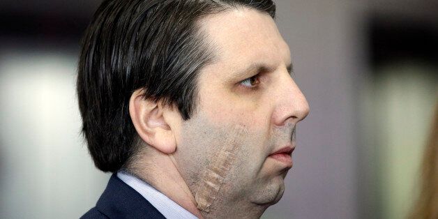 U.S. Ambassador to South Korea Mark Lippert who was attacked by a man with a knife on March 5, listens to U.S. Assistant Secretary of State for East Asian and Pacific Affairs Daniel Russel at the Foreign Ministry in Seoul, South Korea, Tuesday, March 17, 2015. (AP Photo/Lee Jin-man)