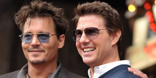 Actors Johnny Depp, left, and Tom Cruise appear at a ceremony honoring film producer Jerry Bruckheimer with a star on the Hollywood Walk of Fame on Monday, June 24, 2013 in Los Angeles. (Photo by John Shearer/Invision/AP)