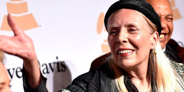 In this Feb.7, 2015 file photo, Joni Mitchell arrives at the 2015 Clive Davis Pre-Grammy Gala at the Beverly Hilton Hotel in Beverly Hills, Calif. Mitchell was hospitalized in Los Angeles on Tuesday, March 31, 2015 according to the Twitter account and website of the folk singer and Rock and Roll Hall of Famer, but details on her condition have not been released.  (Photo by John Shearer/Invision/AP, File)