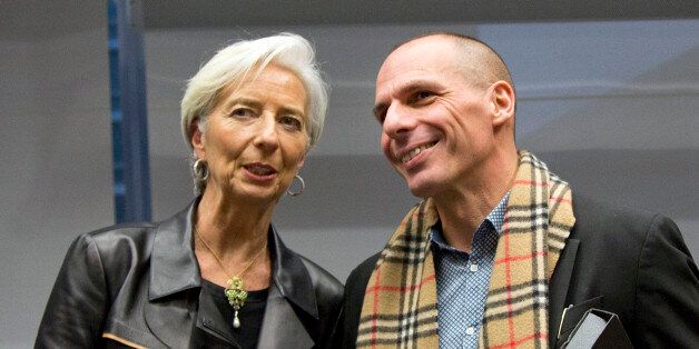 Managing Director of the International Monetary Fund Christine Lagarde, left, shakes hands with Greek Finance Minister Yanis Varoufakis during a meeting of eurogroup finance ministers in Brussels on Wednesday, Feb. 11, 2015. Leading European officials downplayed expectations that a comprehensive debt deal with Greece is likely Wednesday at an emergency meeting in which Greeceâs finance minister is set to unveil a plan to loosen austerityâs grip on his economy. (AP Photo/Virginia Mayo)