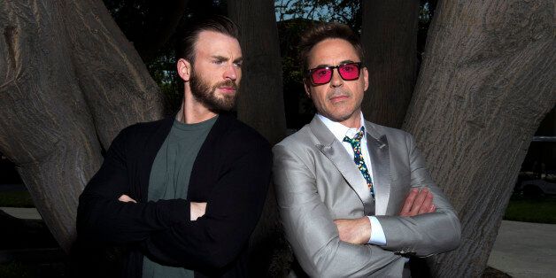 Chris Evans, left, and Robert Downey Jr. pose during a portrait session for