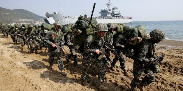 South Korean Marines march after they landed on the beach during the U.S.-South Korea joint landing military exercises as a part of the annual joint military exercise Foal Eagle between South Korea and the United States in Pohang, south of Seoul, South Korea, Monday, March 30, 2015. (AP Photo/Lee Jin-man)