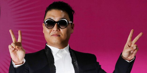 South Korean rapper PSY poses during a news conference for his concert