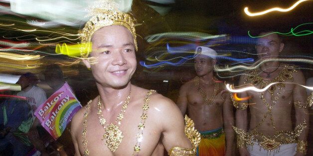 Participants walk on a street during a gay parade festival, organized by gay rights groups, in Bangkok, Thailand, Sunday, Nov. 16, 2003. (AP Photo/Sakchai Lalit)
