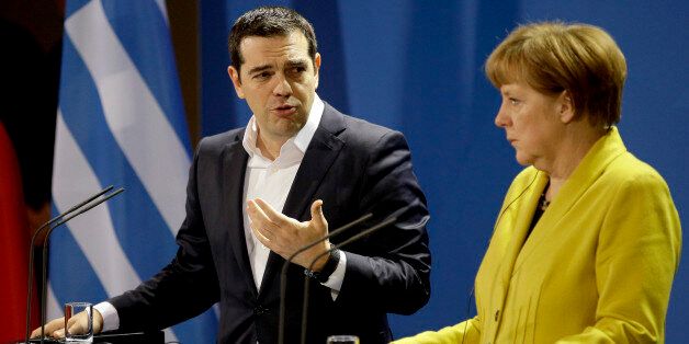 German Chancellor Angela Merkel, right, and the Prime Minister of Greece Alexis Tsipras address the media during a press conference as part of a meeting at the chancellery in Berlin, Germany, Monday, March 23, 2015. (AP Photo/Michael Sohn)