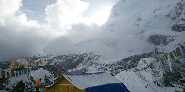 This photo provided by Azim Afif, shows a small avalanche on Pumori mountain as seen from Everest Base Camp, Nepal on Sunday, April 26, 2015. On Saturday, a large avalanche triggered by Nepal's massive earthquake slammed into a section of the Mount Everest mountaineering base camp, killing a number of people and left others unaccounted for. Afif and his team of four others from the Universiti Teknologi Malaysia (UTM) all survived the avalanche. (Azim Afif via AP)