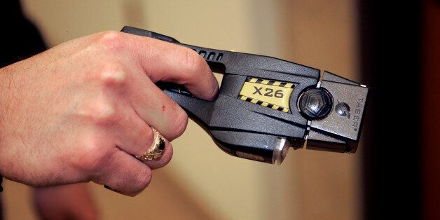 A Taser X26 stun gun is displayed at the Oakland Country Sheriff's office in Pontiac, Mich., Tuesday, Dec. 12, 2006. A little-noticed bill that would let more people use Tasers and stun guns in Michigan is awaiting Gov. Jennifer Granholm's signature, though critics hope she wields her veto pen. The legislation approved by the state Senate 30-7 last week would exempt detention facilities and private security officers at some hospitals and malls from a ban against Tasers, which have been criticize