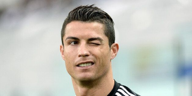 Real Madrid's Cristiano Ronaldo winks during a training session ahead of Tuesday's Champions League semifinal first leg soccer match between Juventus and Real Madrid, at Turin's Juventus Stadium, Italy, Monday, May 4, 2015. (AP Photo/Massimo Pinca)