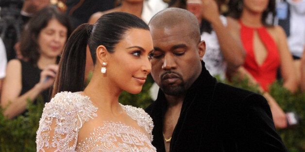 Kim Kardashian, left, and Kanye West arrive at The Metropolitan Museum of Art's Costume Institute benefit gala celebrating