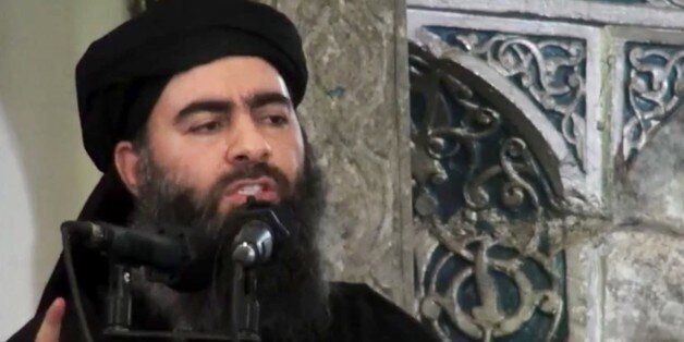 FILE - This file image made from video posted on a militant website Saturday, July 5, 2014, which has been authenticated based on its contents and other AP reporting, purports to show the leader of the Islamic State group, Abu Bakr al-Baghdadi, delivering a sermon at a mosque in Iraq during his first public appearance. The Islamic State group's gains over the past year have been sizeable. For nearly two decades, al-Qaida was unchallenged as the world's most prominent terrorist organization. But