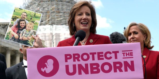 Rep. Vicky Hartzler, R-Mo., center, speaks during a news conference on the Pain-Capable Unborn Child Protection Act  on Capitol Hill in Washington, Wednesday, May 13, 2015. Republicans predicted House passage Wednesday of the late-term abortion ban after dropping rape provisions that angered female GOP lawmakers and forced party leaders into an embarrassing retreat. Rep. Ann Wagner, R-Mo., listens at right.  (AP Photo/Susan Walsh)