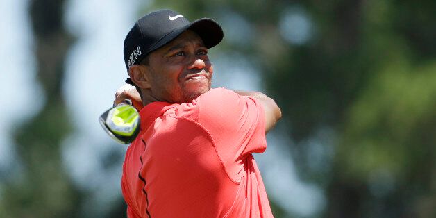 Tiger Woods hits from the 16 tee during the final round of The Players Championship golf tournament Sunday, May 10, 2015, in Ponte Vedra Beach, Fla. (AP Photo/Lynne Sladky)