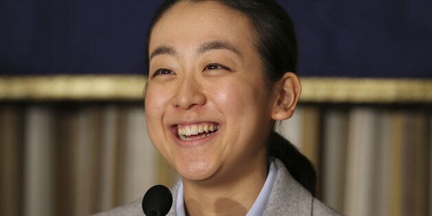 Japanese figure Skater Mao Asada smiles during a press conference at the Foreign Correspondents' Club of Japan in Tokyo Tuesday, Feb. 25, 2014 upon returning from Sochi, Russia. Asada says there is a 50-50 chance she will continue her career after an impressive performance in the free skate at the Sochi Olympics. Asada fell on her trademark triple axel to finish a disappointing 16th after the short program in Sochi but came back strong in the free skate, recording a season's best of 142.71 that