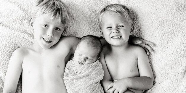 Last one tonight of this cute newborn session done in August....These big brothers were so proud!