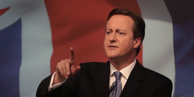 Britain's  Prime Minister David Cameron gestures as he unveils the Conservative party manifesto, in Swindon, England, Tuesday April 14, 2015.  Britain goes to the polls for a parliamentary election on Thursday May 7, 2015. (Peter Macdiarmid, Pool Photo via AP)