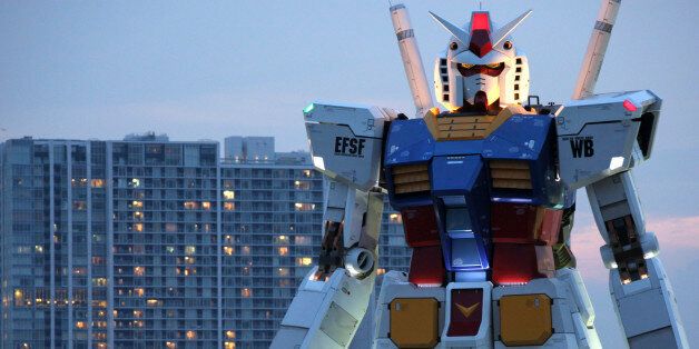 An 18-meter (60-foot) tall Gundam appears at a Tokyo park Saturday, July 11, 2009. The full-size model of Japan's popular robot animation character was built, marking the 30th anniversary of the start of the animation on TV broadcasting. Gundam is a giant robot that has a roll in the era of space wars. (AP Photo/Koji Sasahara)