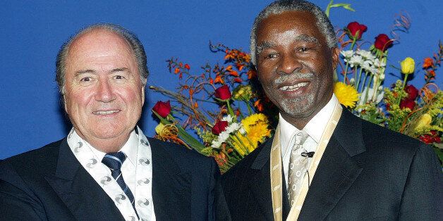 South African President Thabo Mbeki, right, shakes hands with FIFA President Sepp Blatter, left, at Union Building in Pretoria, South Africa, Thursday, Jan. 13, 2005. Blatter, accepted on behalf of the world football governing body one of South Africa's highest civil award. (AP Photo/Lefty Shivambu, BackPagePix)