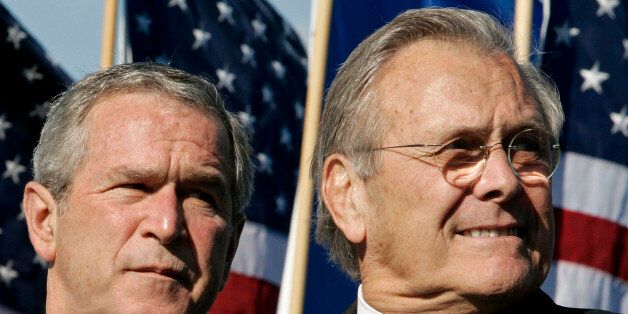** FILE ** President Bush, left, and Defense Secretary Donald H. Rumsfeld, attend the official dedication ceremony for the U.S. Air Force Memorial, in Arlington, Va. in this Oct. 14, 2006 file photo. Republican officials say Rumsfeld is stepping down. Word comes a day after the Democratic gains in the election, in which Rumsfeld was a focus of much of the criticism of the Iraq war. (AP Photo/Haraz N. Ghanbari, File)