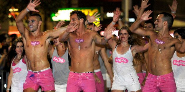 Men and women dance around during the 2011 Gay and Lesbian Mardi Gras in Sydney, Australia, Saturday, March 5, 2011.(AP Photo/Rob Griffith)