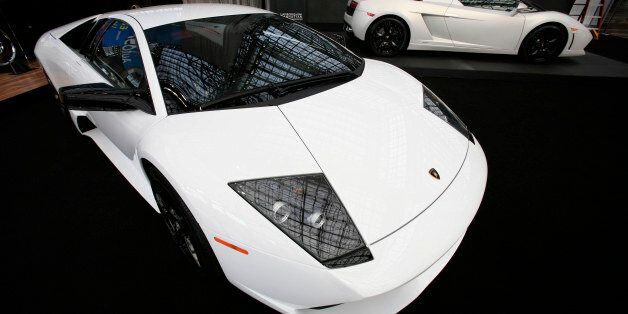 Lamborghini coupe and convertable are shown at the New York International Auto Show Wednesday, April 8, 2009 in New York. The show opens to the public Friday. (AP Photo/Mark Lennihan)