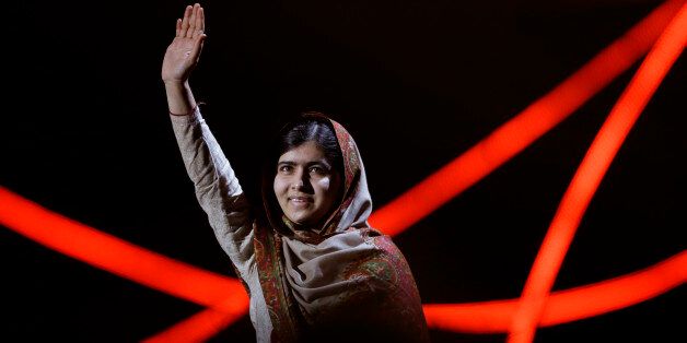 Joint-Nobel Peace Prize winner Malala Yousafzai from Pakistan waves as she arrives to speak on stage during the Nobel Peace Prize Concert in Oslo, Norway, Thursday, Dec. 11, 2014.  Malala Yousafzai from Pakistan and Kailash Satyarthi of India received the Nobel Peace Prize on Wednesday for risking their lives to help protect children from slavery, extremism and forced labor at great risk to their own lives.  (AP Photo/Matt Dunham)
