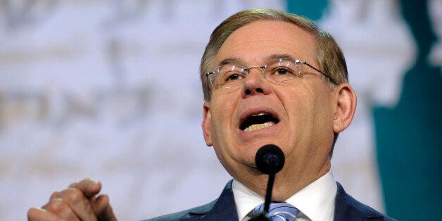 FILE - In this March 5, 2013 file photo, Senate Foreign Relations Committee Chairman Sen. Robert Menendez, D-N.J., addresses the American-Israeli Public Affairs Committee (AIPAC) 2013 Policy Conference at the Walter E. Washington Convention Center in Washington. Beyond the investigations, it's business as usual for Menendez. The newly minted Foreign Relations Committee chairman presides over hearings on North Korea and counterterrorism, travels to Afghanistan and Pakistan and meets privately wit