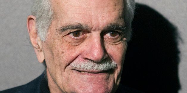 Egyptian film star Omar Sharif poses as he arrives for the Restored International Film festival presentation, at the Cinematheque Francaise, in Paris, Thursday, Nov. 29, 2012. (AP Photo/ Jacques Brinon)