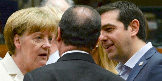 German Chancellor Angela Merkel, left, speaks with French President Francois Hollande, center, and Greek Prime Minister Alexis Tsipras during a meeting of eurozone heads of state at the EU Council building in Brussels on Sunday, July 12, 2015. Skeptical European creditors raced Sunday to narrow differences both among themselves and with Athens, aiming to come up with a tentative agreement to stave off an immediate financial collapse in Greece that would reverberate across the continent. (AP Phot