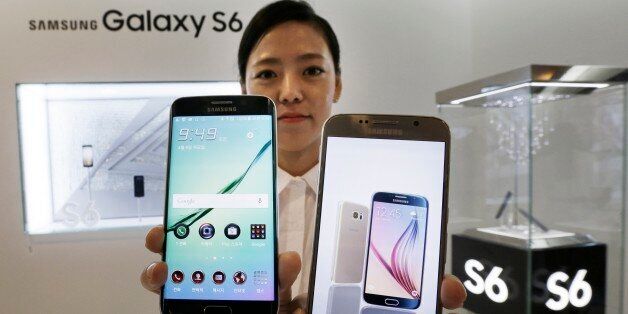 A model poses with a Samsung Electronics Co.'s Galaxy S6, right, and Galaxy S6 Edge, left, smartphones during its launch event at company's headquarter in Seoul, South Korea, Thursday, April 9, 2015. When Samsung dubbed development of its latest smartphones âProject Zero,â it was sounding a note of desperation as sales tumbled and it lost pole position in the crucial Chinese market to rivals Xiaomi and Apple .(AP Photo/Ahn Young-joon)