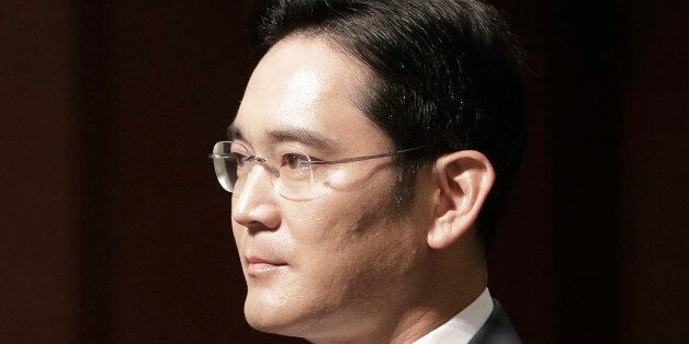 In this June 23, 2015, Lee Jae-yong, vice chairman of Samsung Electronics Co., arrives to attend a press conference at the company's headquarters in Seoul, South Korea. A vote on combining companies in the Samsung empire is pitting South Koreaâs richest family against small shareholders and foreign investors. Shareholders at Samsung C&T will vote Friday, July 17 on the proposed takeover of the company by another Samsung company, Cheil Industries. (AP Photo/Ahn Young-joon)
