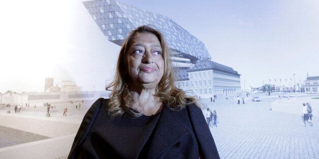 Iraqi born architect Zaha Hadid stands in front of her design of the new Port Authority headquarters in Antwerp, Belgium on Monday, Sept. 10, 2012. The new headquarters, designed by Zaha Hadid, is scheduled to begin construction in September and employees plan to move in in the autumn of 2015. (AP Photo/Virginia Mayo)