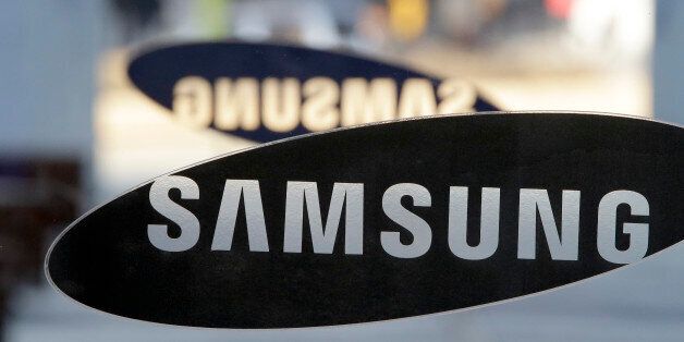 A logo of Samsung Electronics is seen at its showroom in Seoul, South Korea, Thursday, Jan. 8, 2015. Samsung Electronics Co. said Thursday its annual profit fell for the first time in three years as its smartphone growth lost steam. (AP Photo/Lee Jin-man)