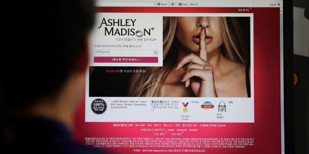 FILE - In this June 10, 2015 photo, Ashley Madison's Korean web site is shown on a computer screen in Seoul, South Korea. Avid Life Media Inc., the parent company of Ashley Madison, a matchmaking website for cheating spouses, said it was hacked and that the personal information of some of its users was posted online. The breach was first reported late Sunday, July 19, 2015, by Brian Krebs of Krebs on Security, a website that focuses on cybersecurity. (AP Photo/Lee Jin-man, File)