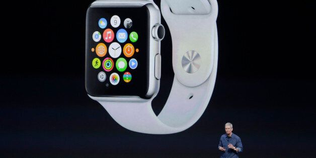 Apple CEO Tim Cook introduces Apple Watch  on Tuesday, Sept. 9, 2014, in Cupertino, Calif. (AP Photo/Marcio Jose Sanchez)