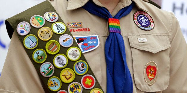 The Boy Scout uniform of Pascal Tessier, 17, a gay Eagle Scout from Kensington, Md., includes his merit badges and a rainbow-colored neckerchief slider, as he speaks in front of a group of Boy Scouts and scout leaders, Wednesday, May 21, 2014, outside the headquarters of Amazon.com in Seattle. The group delivered a petition to Amazon that was started as an online effort by Tessier and gathered more than 125,000 signatures, urging Amazon to stop donating money to the Boy Scouts due to the organiz
