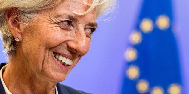 Managing Director of the International Monetary Fund Christine Lagarde smiles as she leaves after a meeting of eurozone heads of state at the EU Council building in Brussels on Monday, July 13, 2015.  A summit of eurozone leaders reached a tentative agreement with Greece on Monday for a bailout program that includes