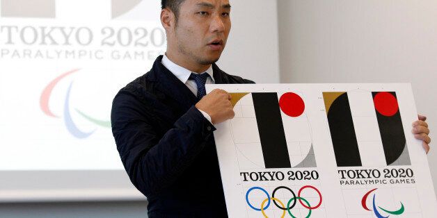 Japanese designer Kenjiro Sano gives a detailed explanation of how he came up with his logo for the 2020 Tokyo Olympics at a press conference in Tokyo, Wednesday, Aug. 5, 2015.  Sano refuted claims Wednesday that he copied the emblem of a Belgian theater when he created the official logo for the 2020 Tokyo Olympics. Belgian designer Olivier Debie has asked the International Olympic Committee and Tokyo Olympic organizers to change the logo because it bears too much resemblance to his emblem for t