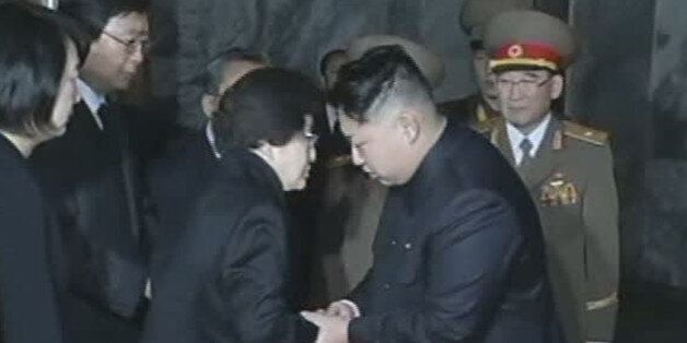 In this Dec. 26, 2011 image made from APTN video, Kim Jong Un, right, late North Korean leader Kim Jong Il's youngest known son and successor, shakes hands with Lee Hee-ho, the wife of former South Korean President Kim Dae-jung who visits Kumsusan Memorial Palace to pay respects to the late leader in Pyongyang, North Korea. (AP Photo/APTN)