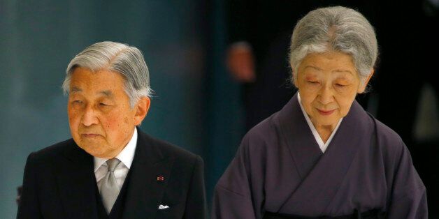 Japan's Emperor Akihito, accompanied by Empress Michiko, leaves after delivering his remarks during a memorial service at Nippon Budokan martial arts hall in Tokyo, Saturday, Aug. 15, 2015. Japan marked Saturday the 70th anniversary of the end of World War II. (AP Photo/Shizuo Kambayashi)