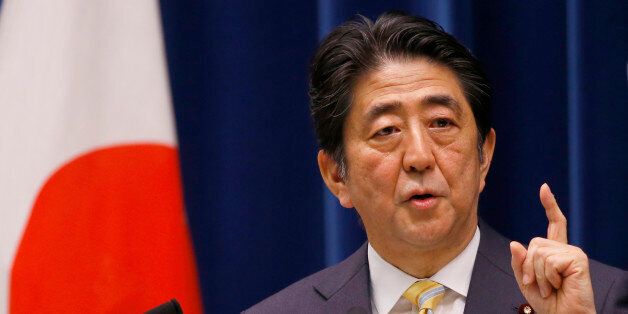 Japan's Prime Minister Shinzo Abe speaks during a press conference at his official residence in Tokyo, Thursday, May 14, 2015. Japan's Cabinet endorsed a set of defense bills Thursday that would allow the country's military to go beyond its self-defense stance and play a greater role internationally, a plan that has split public opinion. (AP Photo/Shizuo Kambayashi)